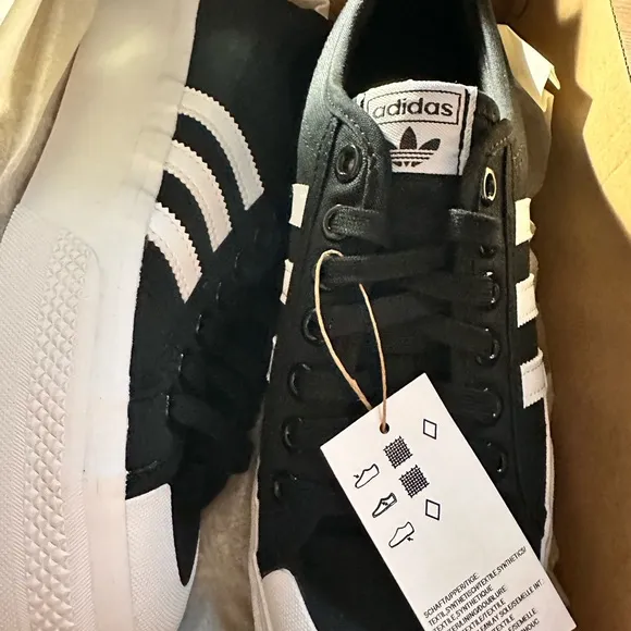 Adidas Black and White nizza platform women’s shoes.  Size 10. New in box.