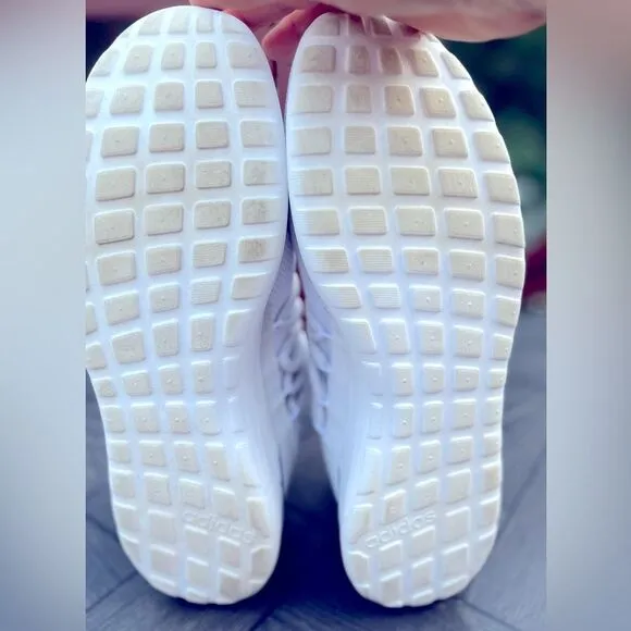 Adidas white/blue trim slip-on tennis shoes. Logo, mesh body, mock laces,13