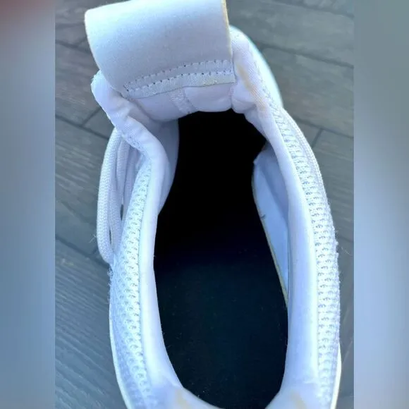 Adidas white/blue trim slip-on tennis shoes. Logo, mesh body, mock laces,13