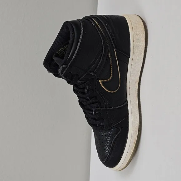 Air Jordan Black and Gold High-Top Sneakers