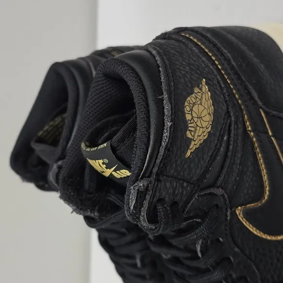 Air Jordan Black and Gold High-Top Sneakers