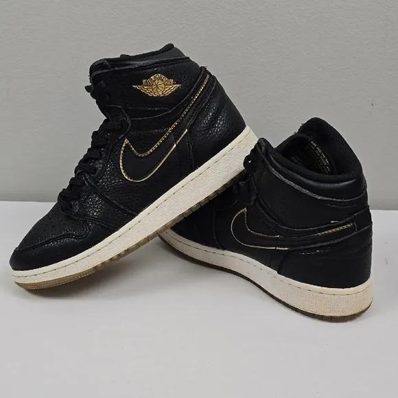 Air Jordan Black and Gold High-Top Sneakers