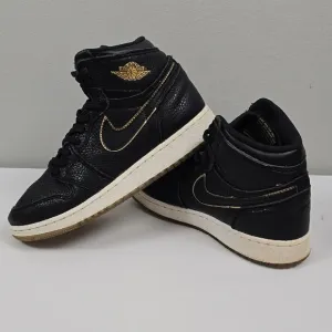 Air Jordan Black and Gold High-Top Sneakers