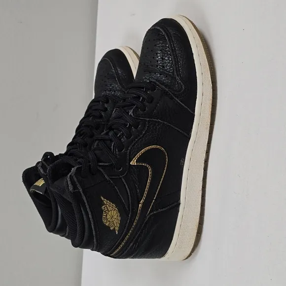 Air Jordan Black and Gold High-Top Sneakers