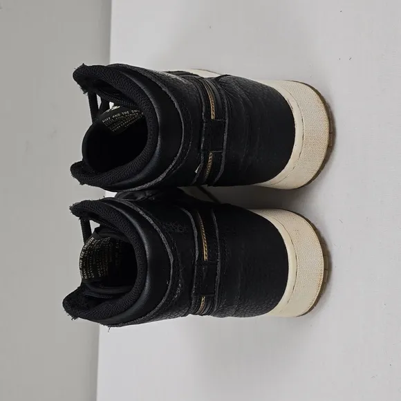 Air Jordan Black and Gold High-Top Sneakers
