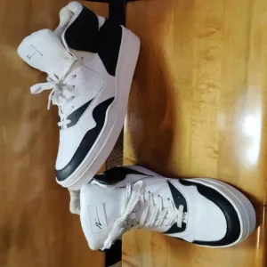 Article No. designed in Los Angeles black and white hi top shoes size 12