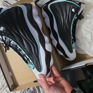 Black and White High-Top Sneakers with Teal Accents
