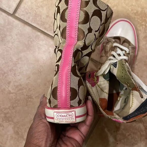 Coach pink high top reversible sneakers.