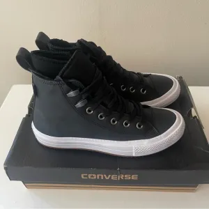 CONVERSE Chuck Taylor high top black sneakers