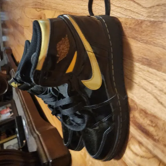 Jordan Black and Gold High-Top Sneakers