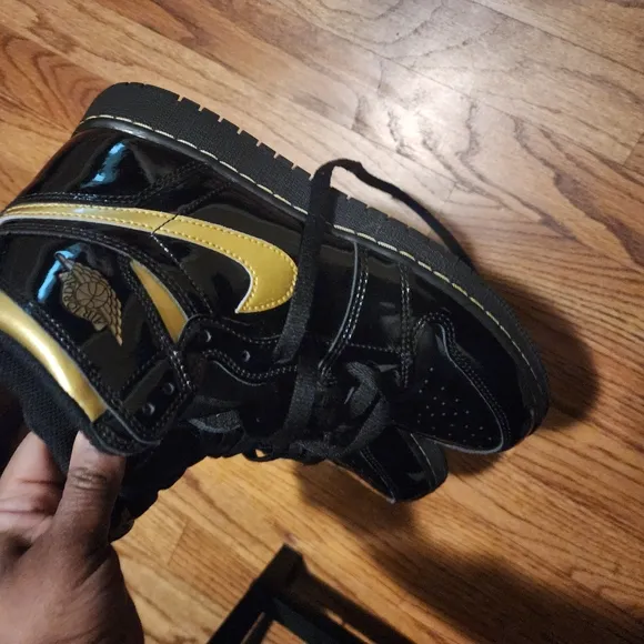 Jordan Black and Gold High-Top Sneakers
