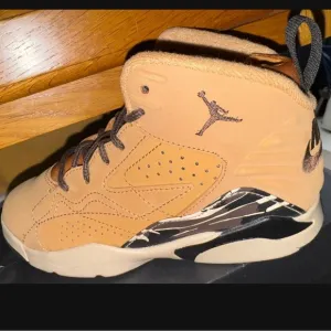 Jordan Tan High-Top Sneakers with Black Accents