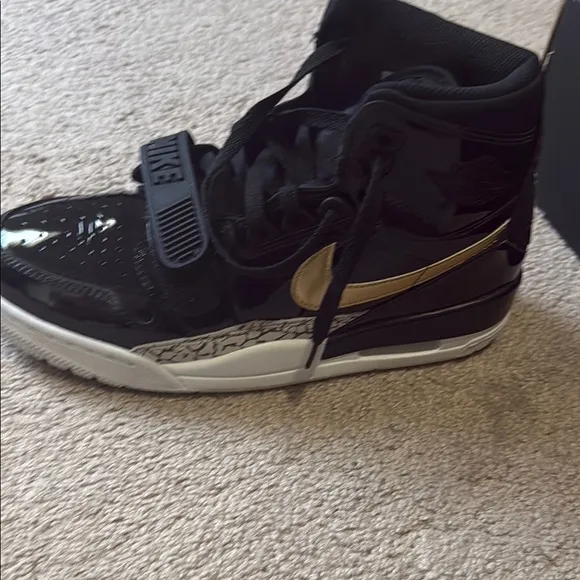 Nike Black and Gold High-Top Sneakers. AIR JORDAN LEGACY 312