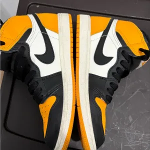 Nike High-Top Sneakers in Black, White, and Orange