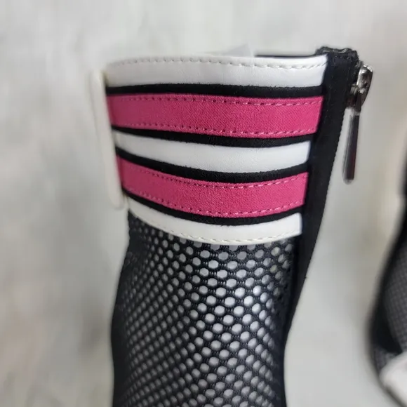 Open toe black mesh stiletto heeled ankle boots.