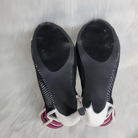 Open toe black mesh stiletto heeled ankle boots.