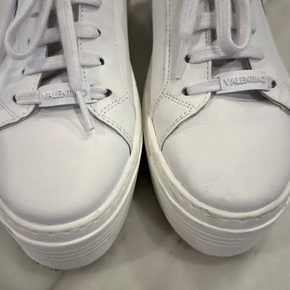 Valentino White platform sneakers with black glittery V in women’s size 8.