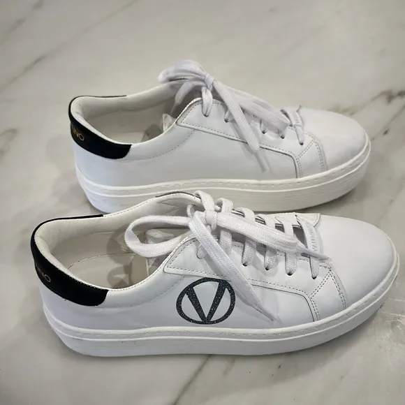 Valentino White platform sneakers with black glittery V in women’s size 8.