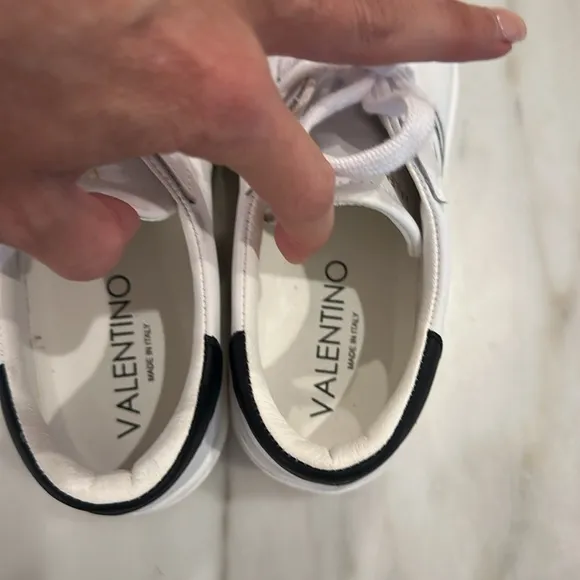 Valentino White platform sneakers with black glittery V in women’s size 8.