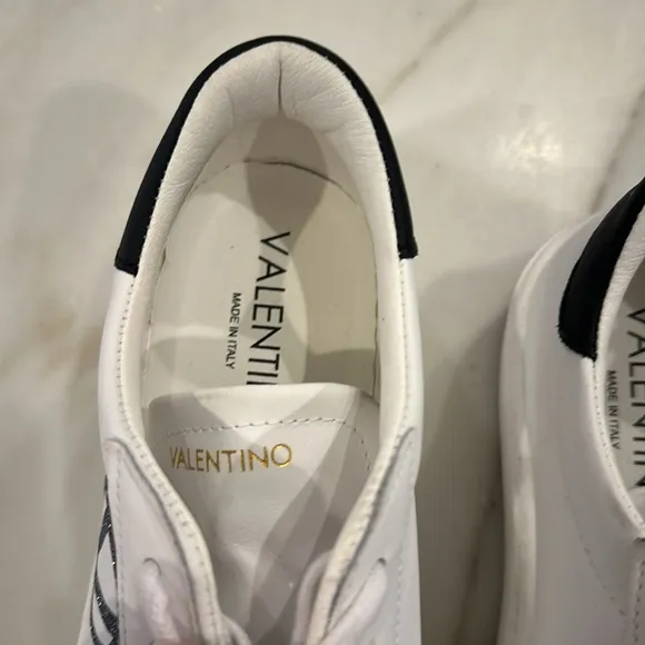 Valentino White platform sneakers with black glittery V in women’s size 8.