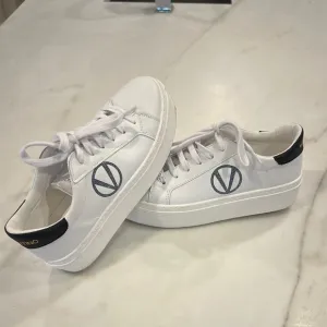 Valentino White platform sneakers with black glittery V in women’s size 8.