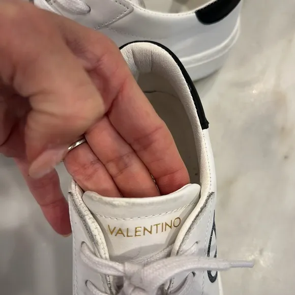 Valentino White platform sneakers with black glittery V in women’s size 8.