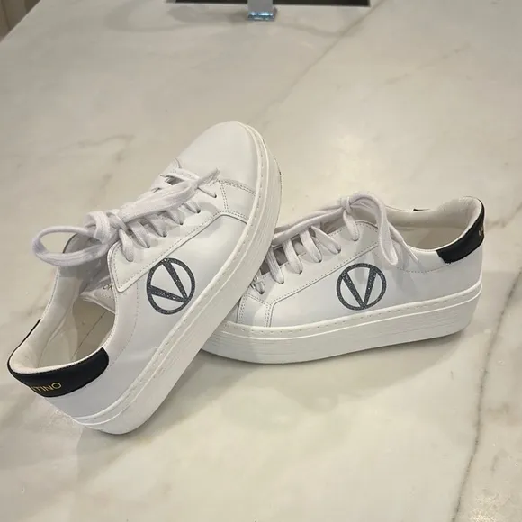 Valentino White platform sneakers with black glittery V in women’s size 8.