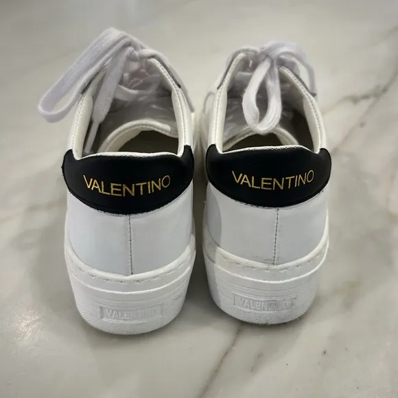 Valentino White platform sneakers with black glittery V in women’s size 8.