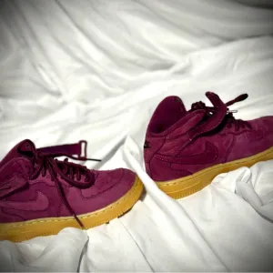 Vibrant Burgundy High-Top Sneakers with Gold Soles