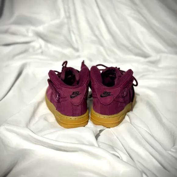 Vibrant Burgundy High-Top Sneakers with Gold Soles